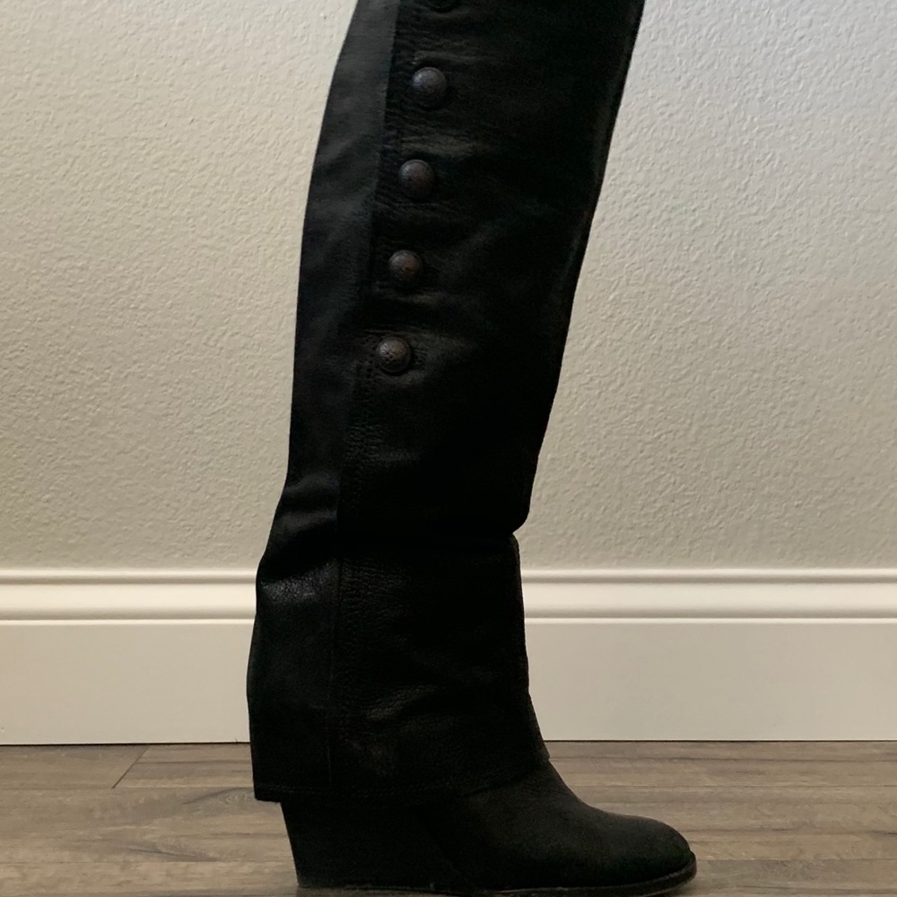 Woman’s calf high leather wedge boot